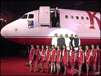 Vijay Mallya, second row left, stands with political leaders during the launch of Kingfisher Airlines in Mumbai, May 7, 2005